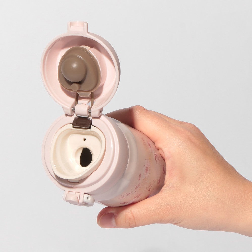 Starbucks Japan SAKURA Shine Brightly 2026 collection merchandise. Limited edition series featuring glitter pink stainless bottles, Stanley collaboration tumblers in pink gradient, and color-changing cups. The design theme highlights vivid spring colors, metallic gold accents, and bright cherry blossom patterns.