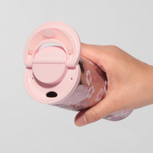 Starbucks Japan SAKURA Shine Brightly 2026 collection merchandise. Limited edition series featuring glitter pink stainless bottles, Stanley collaboration tumblers in pink gradient, and color-changing cups. The design theme highlights vivid spring colors, metallic gold accents, and bright cherry blossom patterns.