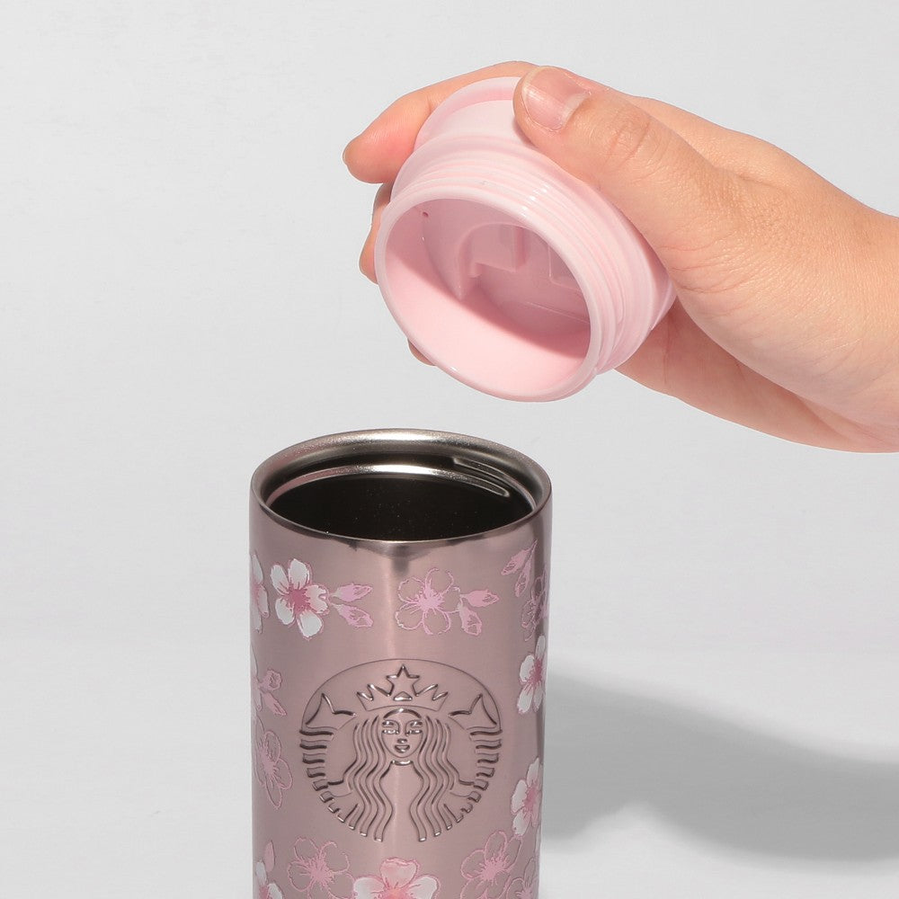 Starbucks Japan SAKURA Shine Brightly 2026 collection merchandise. Limited edition series featuring glitter pink stainless bottles, Stanley collaboration tumblers in pink gradient, and color-changing cups. The design theme highlights vivid spring colors, metallic gold accents, and bright cherry blossom patterns.
