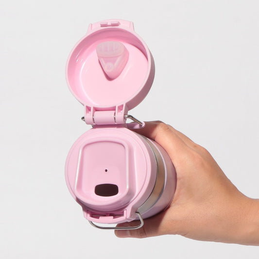 Starbucks Japan SAKURA Shine Brightly 2026 collection merchandise. Limited edition series featuring glitter pink stainless bottles, Stanley collaboration tumblers in pink gradient, and color-changing cups. The design theme highlights vivid spring colors, metallic gold accents, and bright cherry blossom patterns.