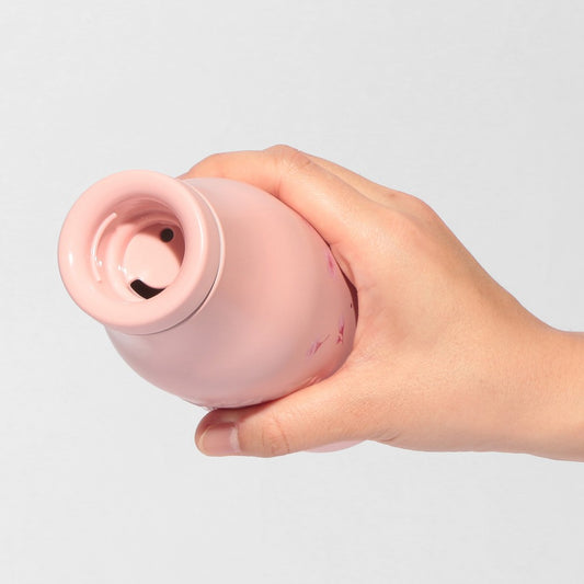 Starbucks Japan SAKURA Shine Brightly 2026 collection merchandise. Limited edition series featuring glitter pink stainless bottles, Stanley collaboration tumblers in pink gradient, and color-changing cups. The design theme highlights vivid spring colors, metallic gold accents, and bright cherry blossom patterns.