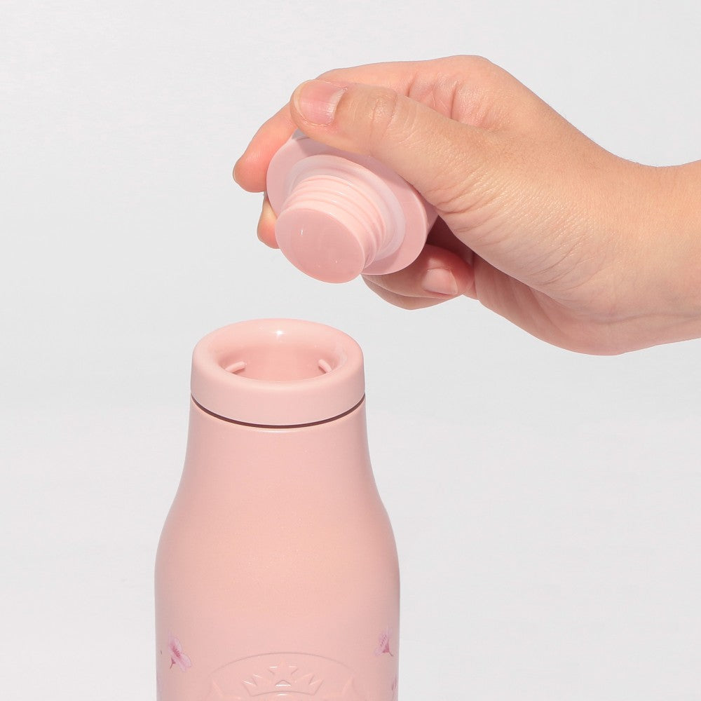 Starbucks Japan SAKURA Shine Brightly 2026 collection merchandise. Limited edition series featuring glitter pink stainless bottles, Stanley collaboration tumblers in pink gradient, and color-changing cups. The design theme highlights vivid spring colors, metallic gold accents, and bright cherry blossom patterns.