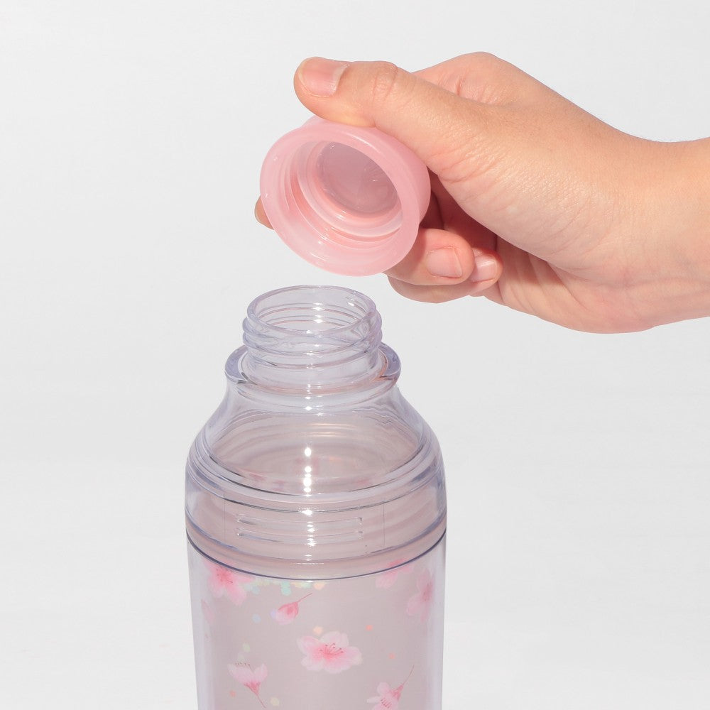 Starbucks Japan SAKURA Shine Brightly 2026 collection merchandise. Limited edition series featuring glitter pink stainless bottles, Stanley collaboration tumblers in pink gradient, and color-changing cups. The design theme highlights vivid spring colors, metallic gold accents, and bright cherry blossom patterns.