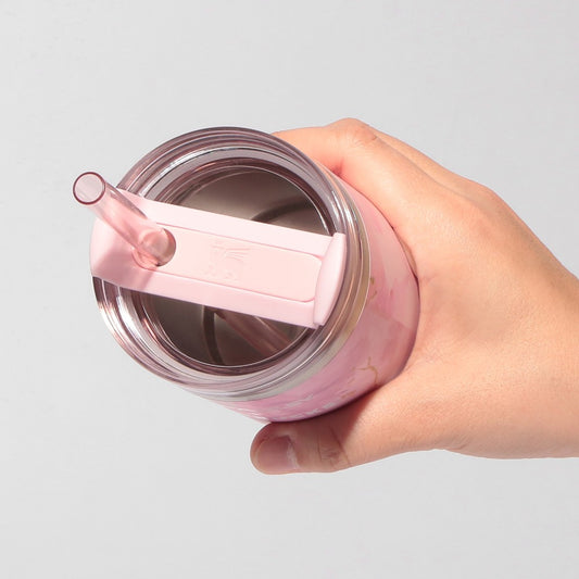 Starbucks Japan SAKURA Shine Brightly 2026 collection merchandise. Limited edition series featuring glitter pink stainless bottles, Stanley collaboration tumblers in pink gradient, and color-changing cups. The design theme highlights vivid spring colors, metallic gold accents, and bright cherry blossom patterns.