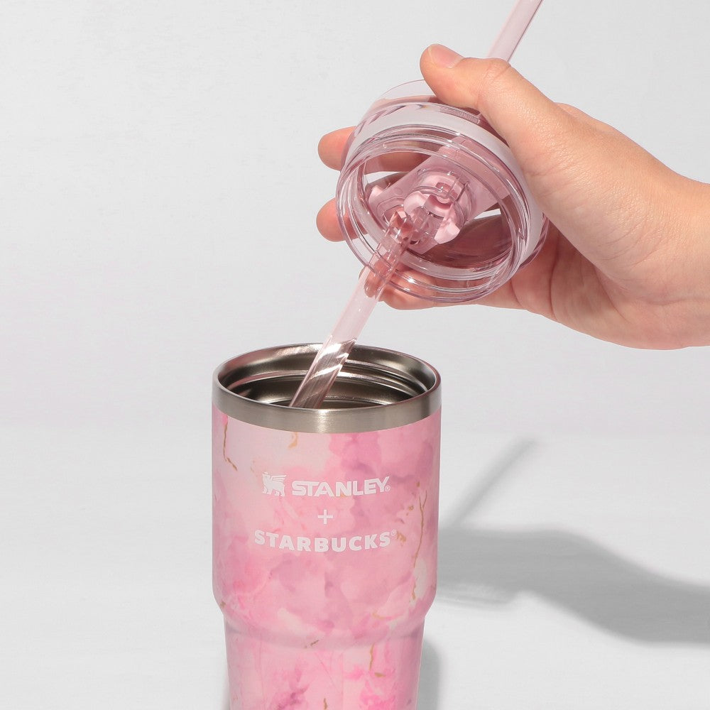Starbucks Japan SAKURA Shine Brightly 2026 collection merchandise. Limited edition series featuring glitter pink stainless bottles, Stanley collaboration tumblers in pink gradient, and color-changing cups. The design theme highlights vivid spring colors, metallic gold accents, and bright cherry blossom patterns.