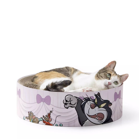 Nekoichi x Disney Store Japan Cat Day collaboration items. A raised ceramic food bowl and circular 'Bali Bali Bowl' scratcher bed featuring illustrations of Lucifer chasing mice Jack and Gus. High-quality cat supplies.