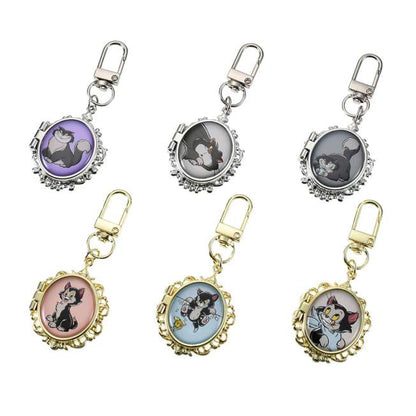 Disney Cat Day 2026 Secret Blind Box package. A mystery collectible item containing one of several Disney Cat characters like Lucifer, Figaro, or the Aristocats. The packaging features a vintage book illustration style.