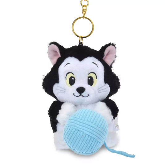 Lucifer and Figaro plush keychains from the Disney Cat Day 2026 series. Fluffy stuffed animal keychains holding a yarn ball or mouse toy. These interactive plushies vibrate when the pull-string toy is pulled.