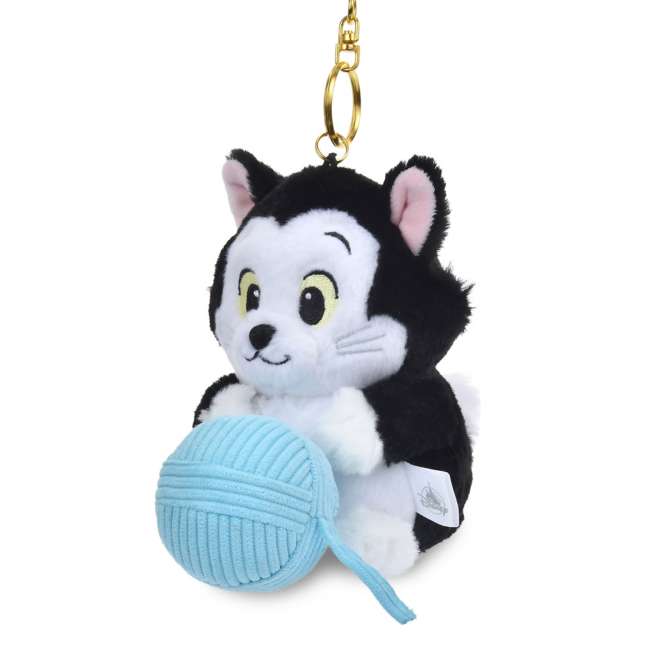 Lucifer and Figaro plush keychains from the Disney Cat Day 2026 series. Fluffy stuffed animal keychains holding a yarn ball or mouse toy. These interactive plushies vibrate when the pull-string toy is pulled.