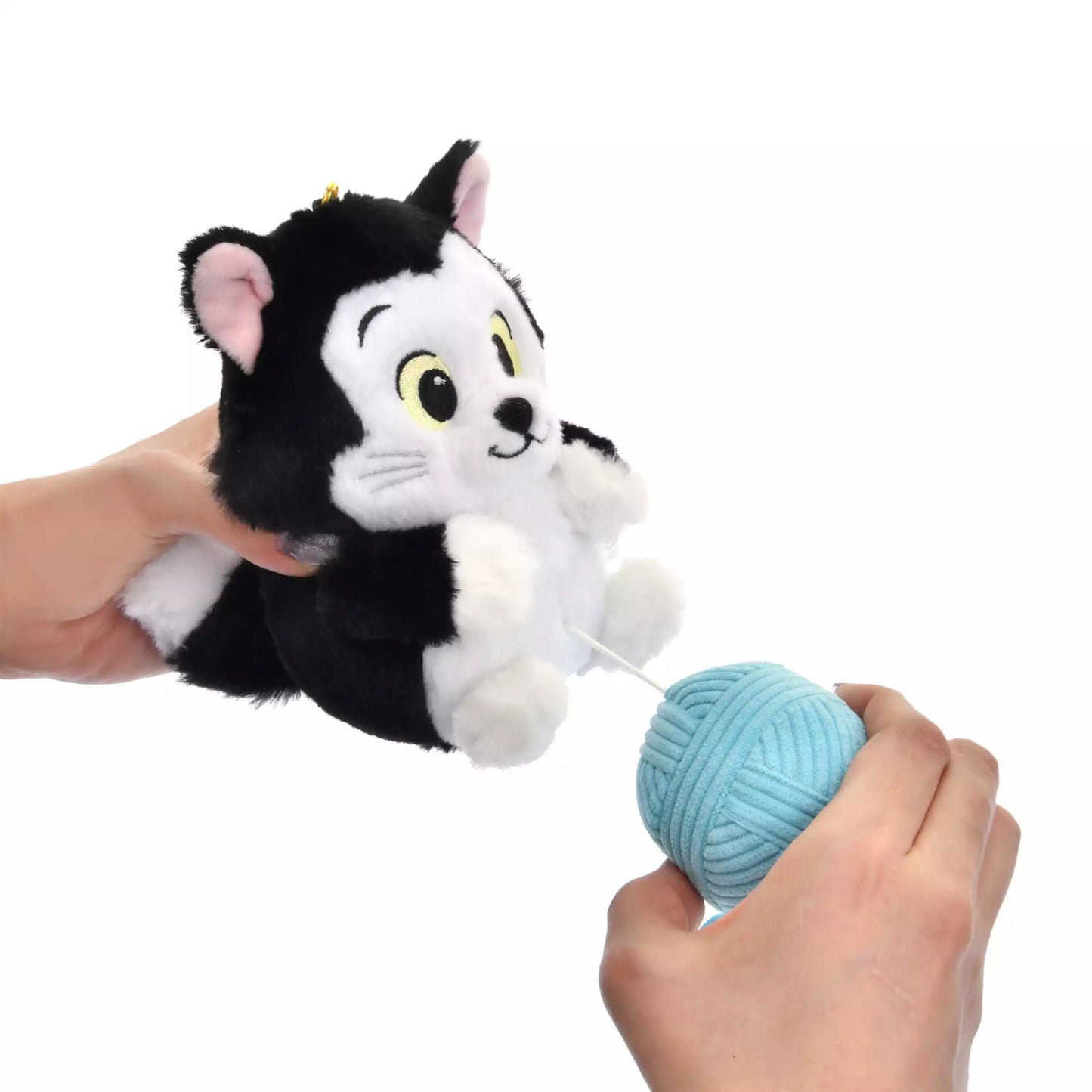 Lucifer and Figaro plush keychains from the Disney Cat Day 2026 series. Fluffy stuffed animal keychains holding a yarn ball or mouse toy. These interactive plushies vibrate when the pull-string toy is pulled.