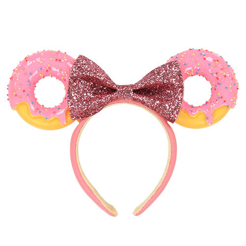 Donut-shaped headband with a glittery bow featuring Minnie Mouse ear.