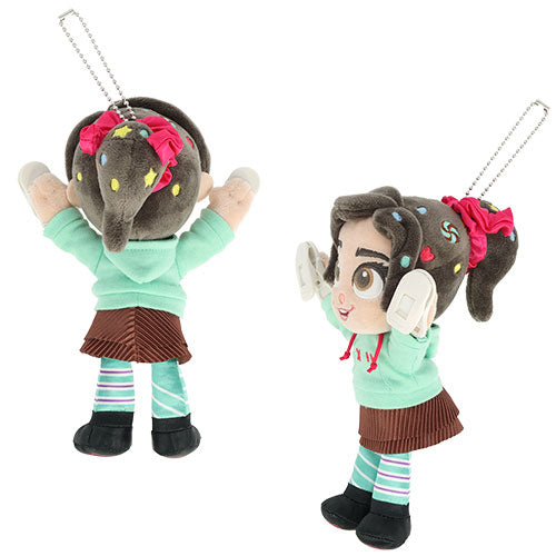 Shoulder plush toy of Vanellope with brown hair, green hoodie, and striped pants.