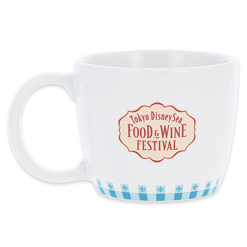 A mug featuring Chef Remy from the 'Food & Wine Festival 2026' collection. The design includes motifs of cheese, grapes, and wine, perfect for making your dining table lively as described in the festival theme.